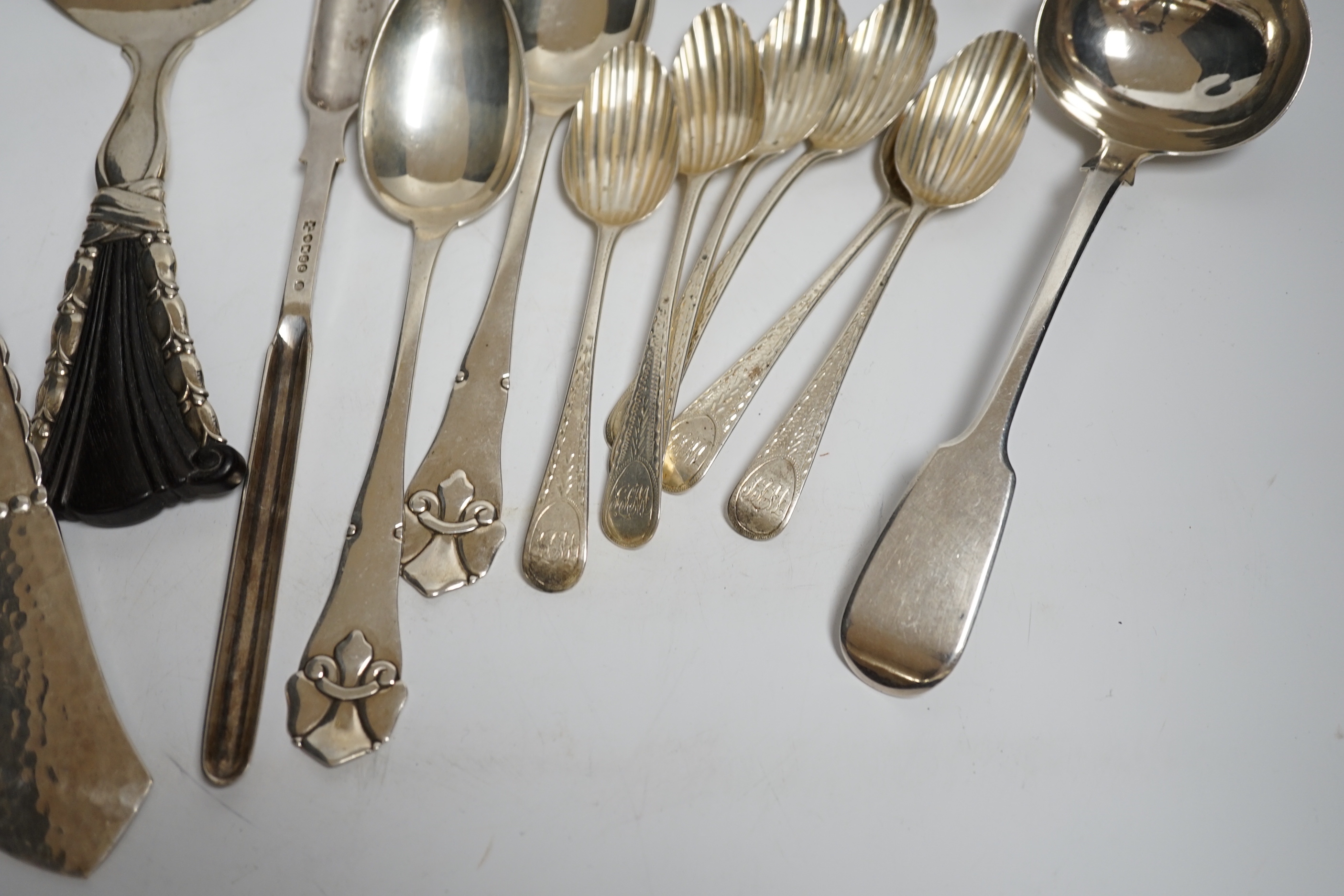 An early to mid 20th century Georg Jensen sterling and hardwood server, 26.1cm and a similar caddy spoon, together with other silver flatware, Scandinavian flatware and a plated marrow scoop.